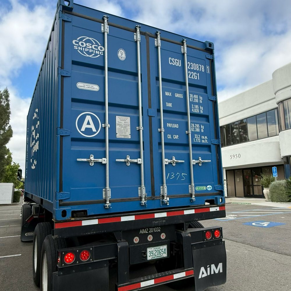 Shipping container arriving at the CholeZ Piano showroom
