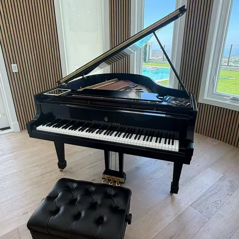 A Steinway grand piano delivered and set up in a customer's home